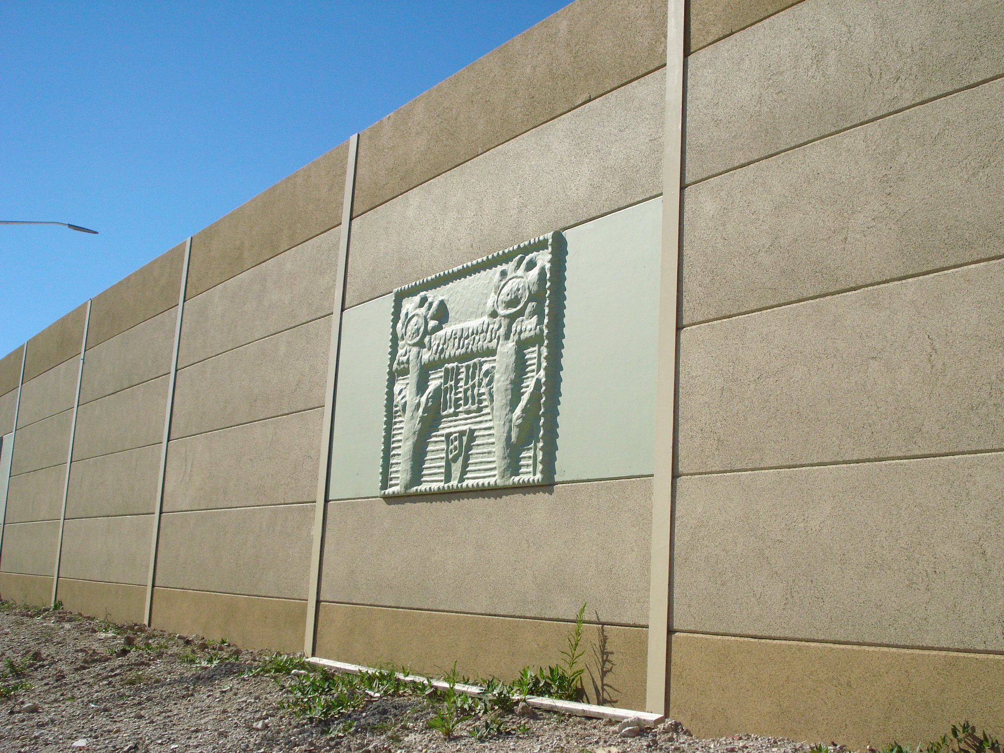 A precast noise barrier featuring custom panels created from children's drawings along I-94 in Milwaukee, WI.