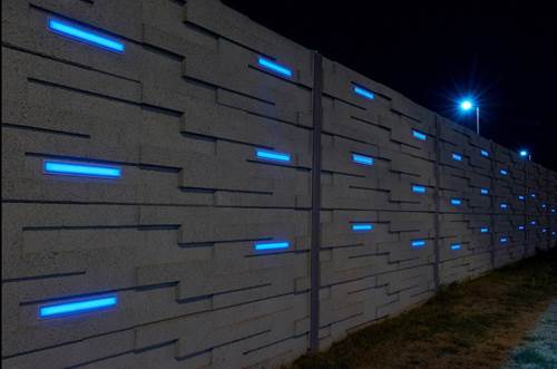 A precast noise barrier with a custom basket-weave pattern and integrated LED lighting at the OC Transpo in Ottawa, ON.