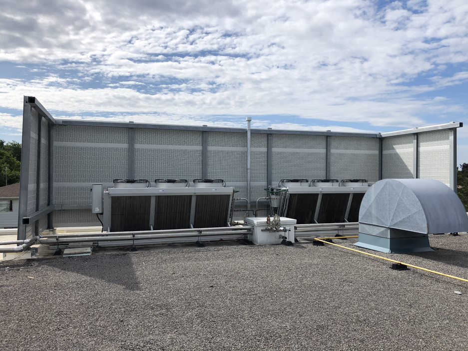 A PVC noise barrier on the rooftop of a food processing facility in the Greater Toronto Area, ON.