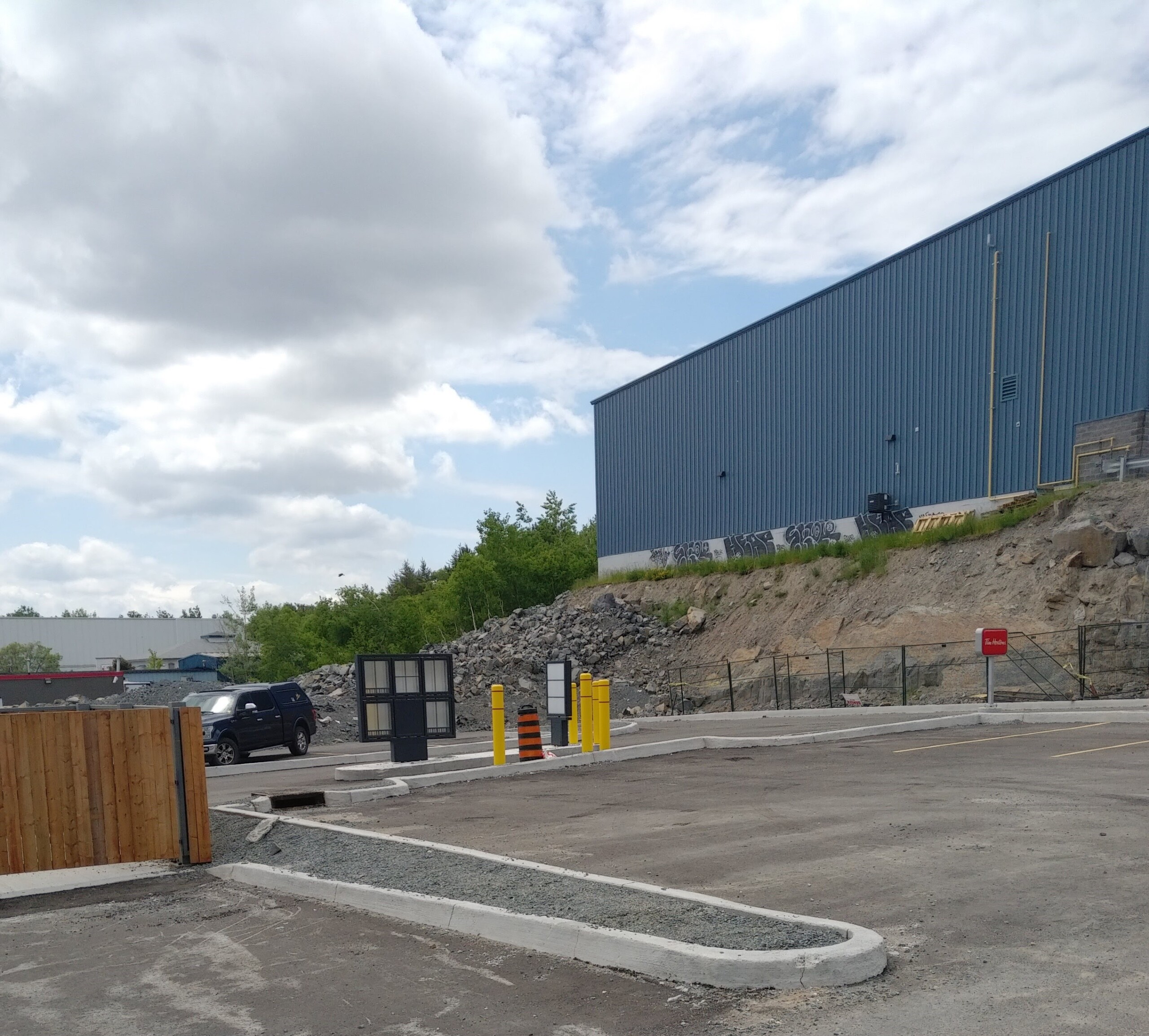 Prior to the installation of the Retain - A - Rock (RAR) Retaining Wall System surrounding a Tim Horton's in Sudbury, ON.