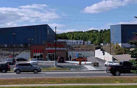 The Retain - A - Rock (RAR) Retaining Wall System surrounding a Tim Horton's in Sudbury, ON.