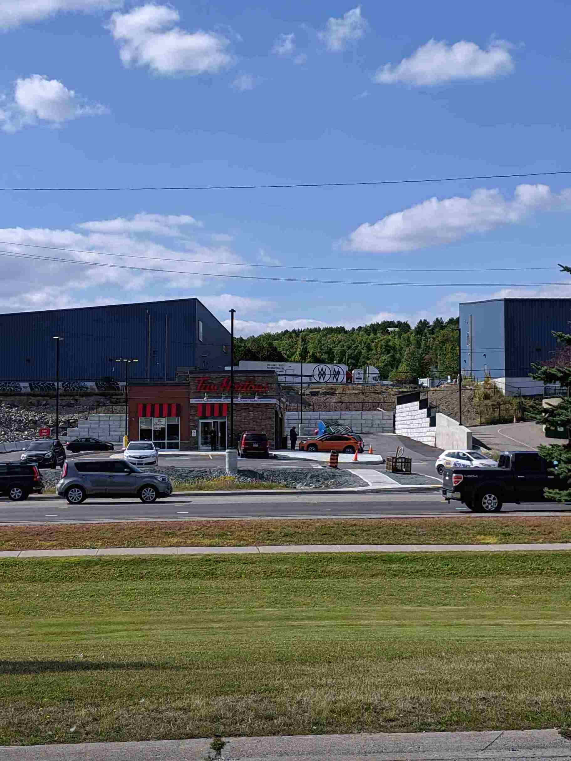 The Retain - A - Rock (RAR) Retaining Wall System surrounding a Tim Horton's in Sudbury, ON.