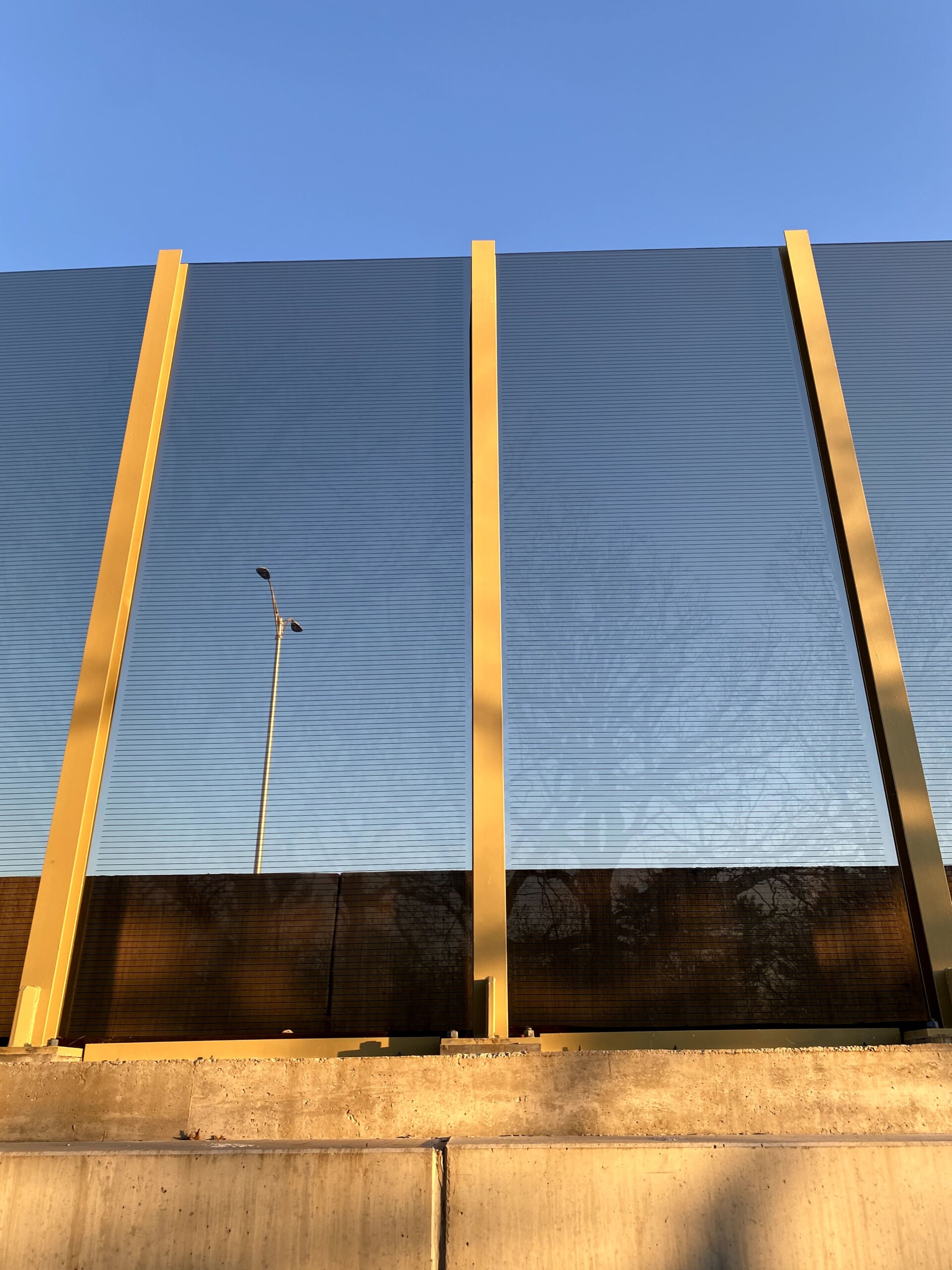 Transparent noise barrier panels with Bird Guard installed on a bridge on the Reagan Memorial Highway (I-88) in Elmhurst, IL.