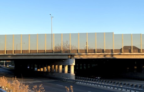 Transparent noise barrier panels with Bird Guard installed on a bridge on the Reagan Memorial Highway (I-88) in Elmhurst, IL.