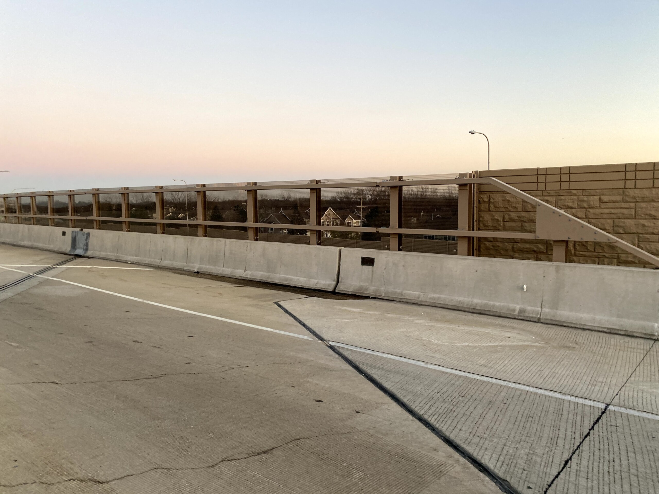 Acrylite Soundstop MASH TL-4 system mounted on a bridge along Illinois Route 390 in Itasca, Illinois.