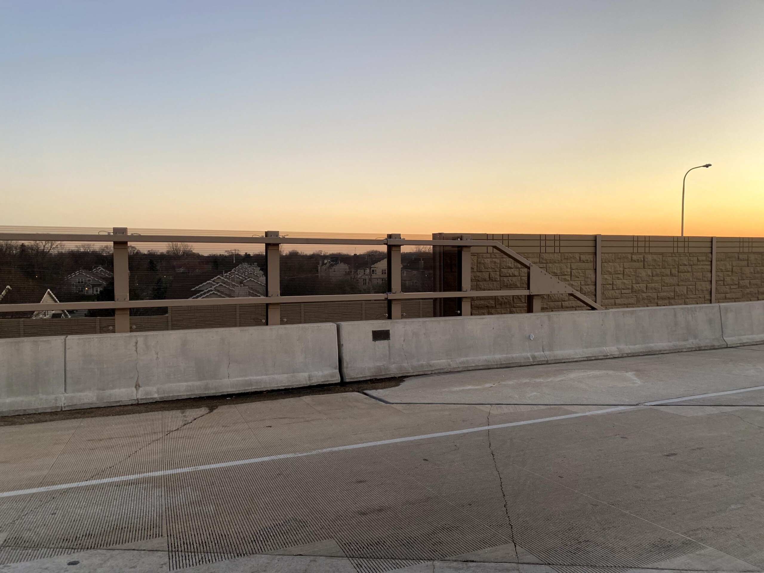 Acrylite Soundstop MASH TL-4 system mounted on a bridge along Illinois Route 390 in Itasca, Illinois.