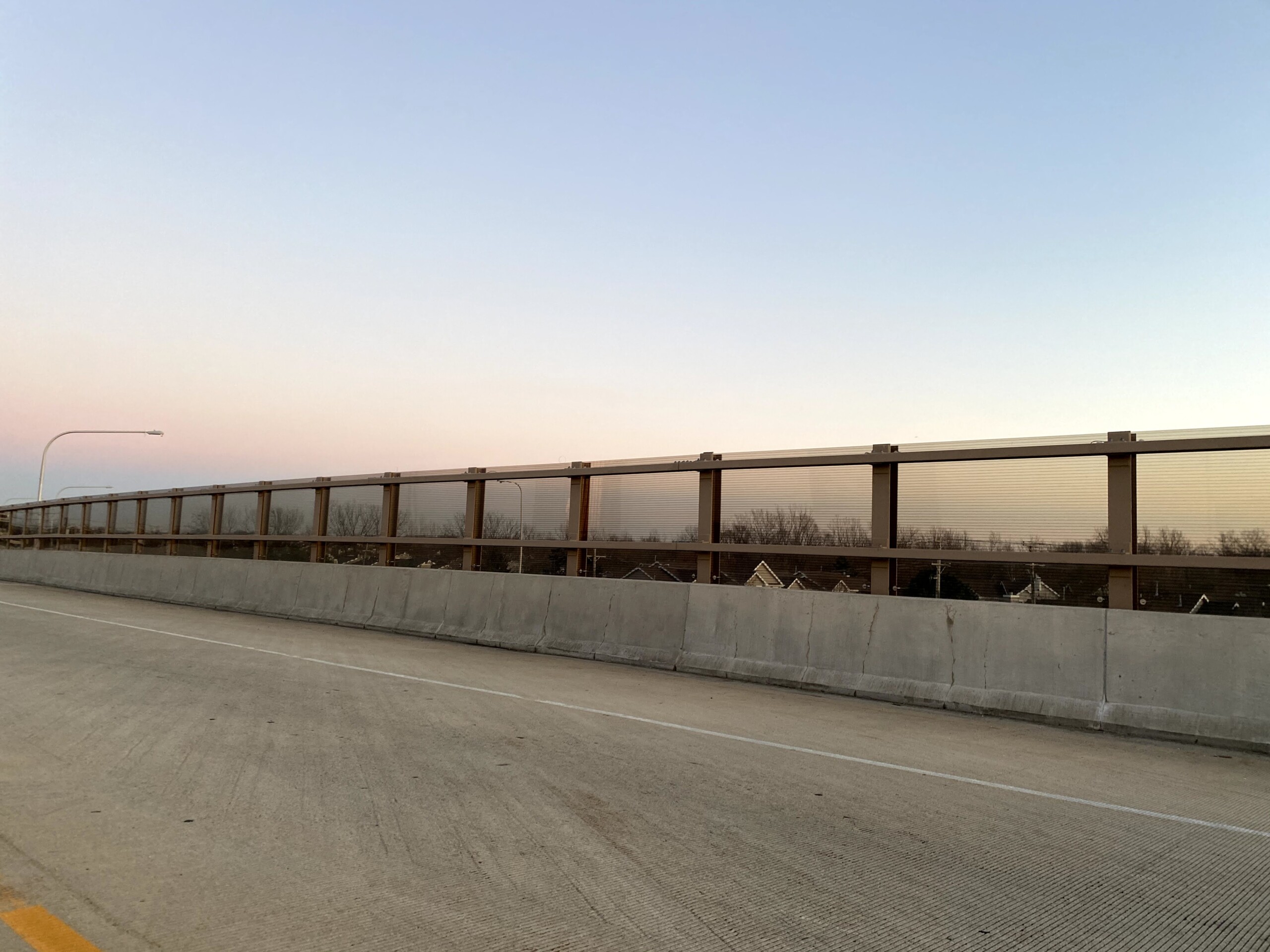 Acrylite Soundstop MASH TL-4 system mounted on a bridge along Illinois Route 390 in Itasca, Illinois.