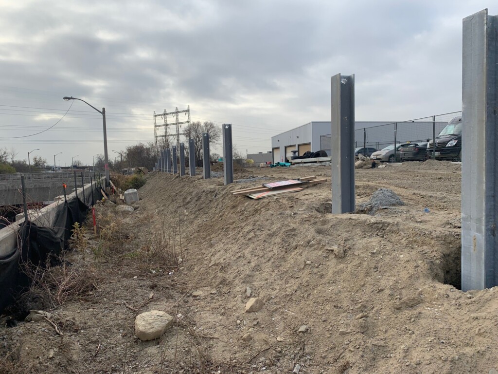 A Mechanically Stabilized Earth (MSE) Retaining Wall system being constructed to surround the Metro Distribution Centre in Etobicoke, Ontario.